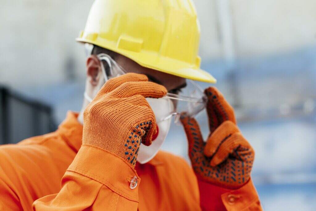 worker uniform with hard hat protective glasses